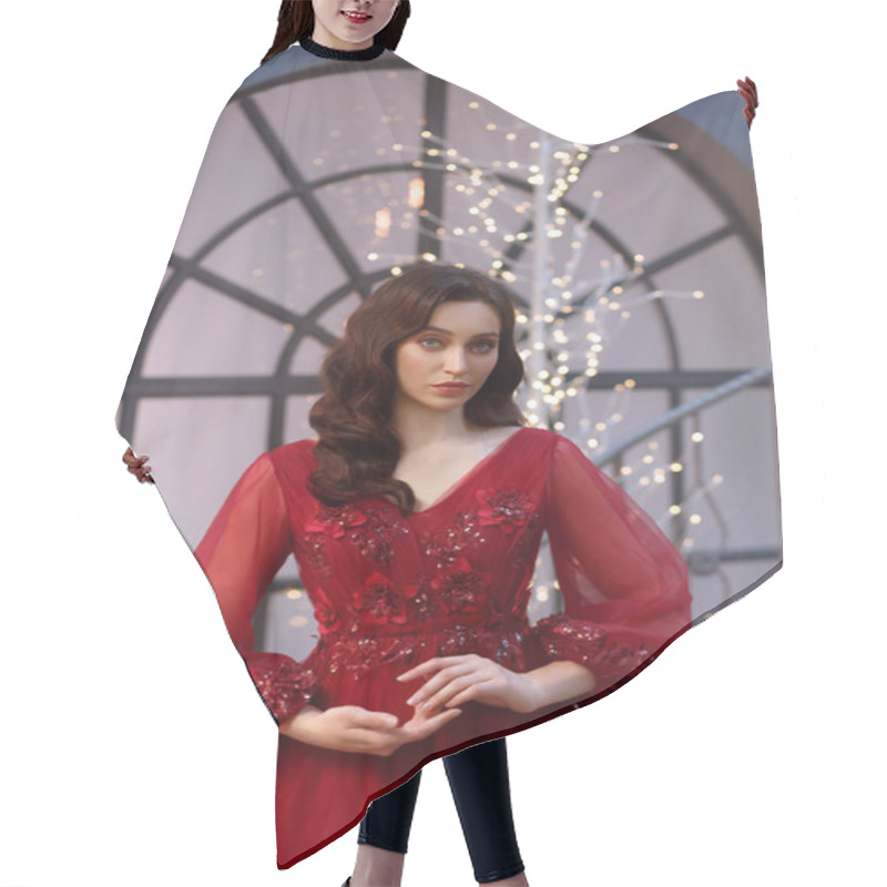 Personality  Image Of A Christmas Witch, A Delightful Red Dress Adorned With Flowers And Sleeves, A Girl With Warm Wavy Hair, A New Years Background In The Photo, Bright Lights Near A Large Window, Hand Grace Hair Cutting Cape