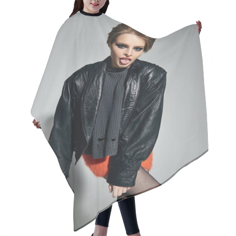 Personality  A Woman In A Leather Jacket Poses With A Playful Expression. Hair Cutting Cape