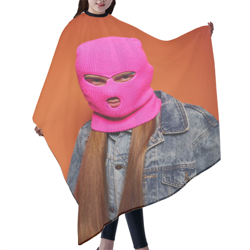 Personality  A Young Man With Long Red Hair Expresses Strong Emotions In A Pink Mask On An Orange Background. Hair Cutting Cape