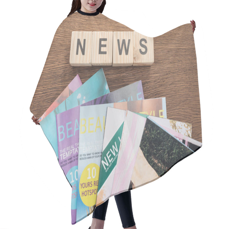 Personality  Top View Of Wooden Cubes With Word News And Magazines On Wooden Tabletop Hair Cutting Cape