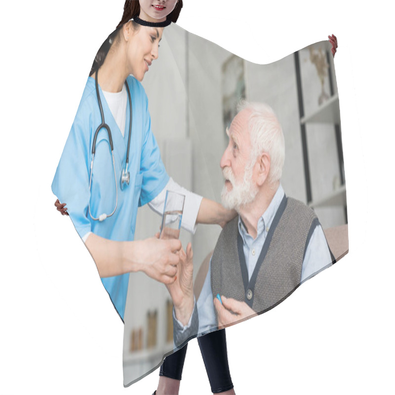 Personality  Nurse Giving Glass Of Water To Elderly Man With Pill In Hand Hair Cutting Cape