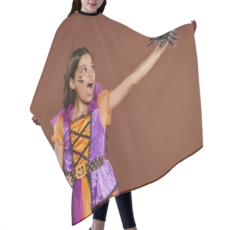 Personality  Scared Girl In Halloween Costume Looking At Black Spider And Screaming On Brown Backdrop, October 31 Hair Cutting Cape