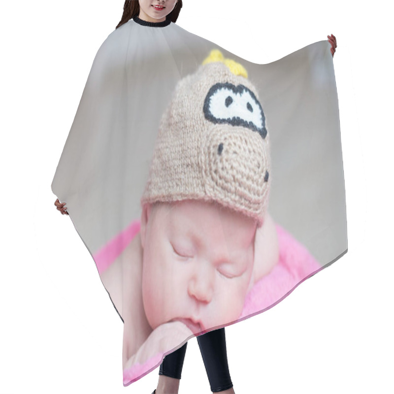 Personality  Cute Happy Newborn Baby In Dragon Knitted Cap Sleeping In Basket On Pink Blanket. Infant Sleeping Portrait. Hair Cutting Cape