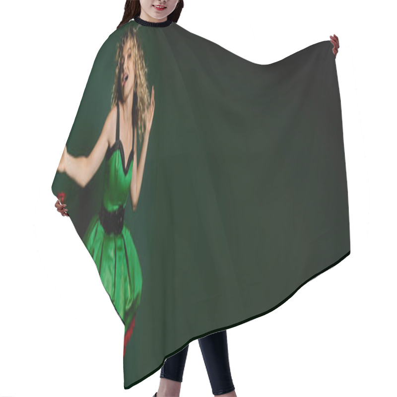 Personality  Jolly Woman In Elf Costume Gesturing With Arms Posing Near Pile Of Gifts On Green Backdrop, Banner Hair Cutting Cape