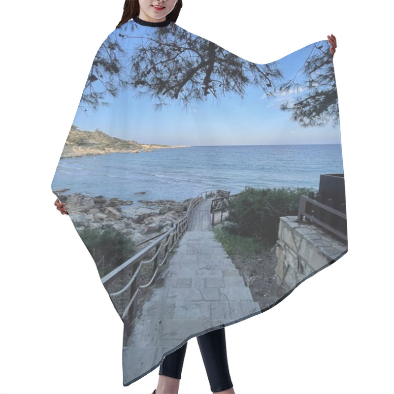 Personality  Picturesque Stone Pathway With Rope Railings Leading To A Serene Beachfront Surrounded By Rocky Coastline And Framed By Pine Tree Branches Hair Cutting Cape