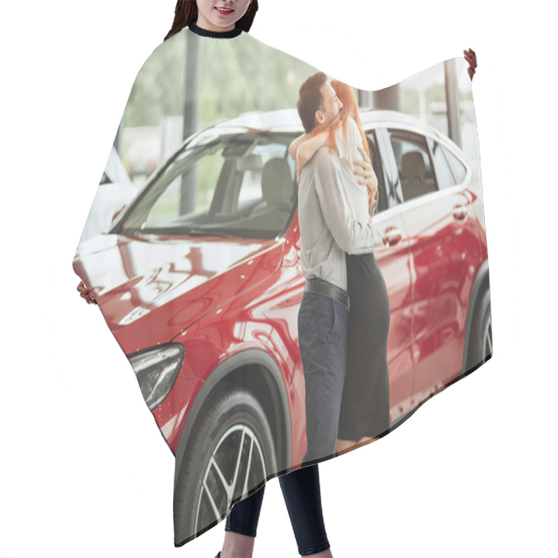 Personality  Couple Hugging While Buying First New Family Car Together In Dealership. Hair Cutting Cape