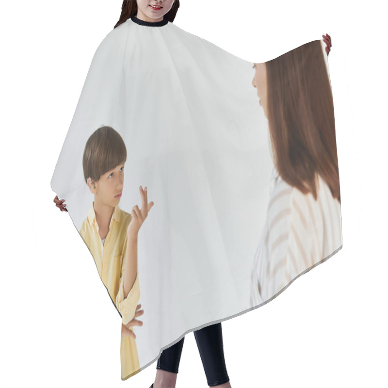 Personality  A Little Boy Communicates Through Sign Language, Expressing His Thoughts To His Caring Mother. Hair Cutting Cape