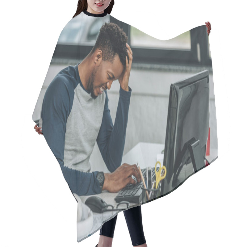 Personality  Upset African American Programmer Holding Hand Near Head While Working On Computer In Office Hair Cutting Cape