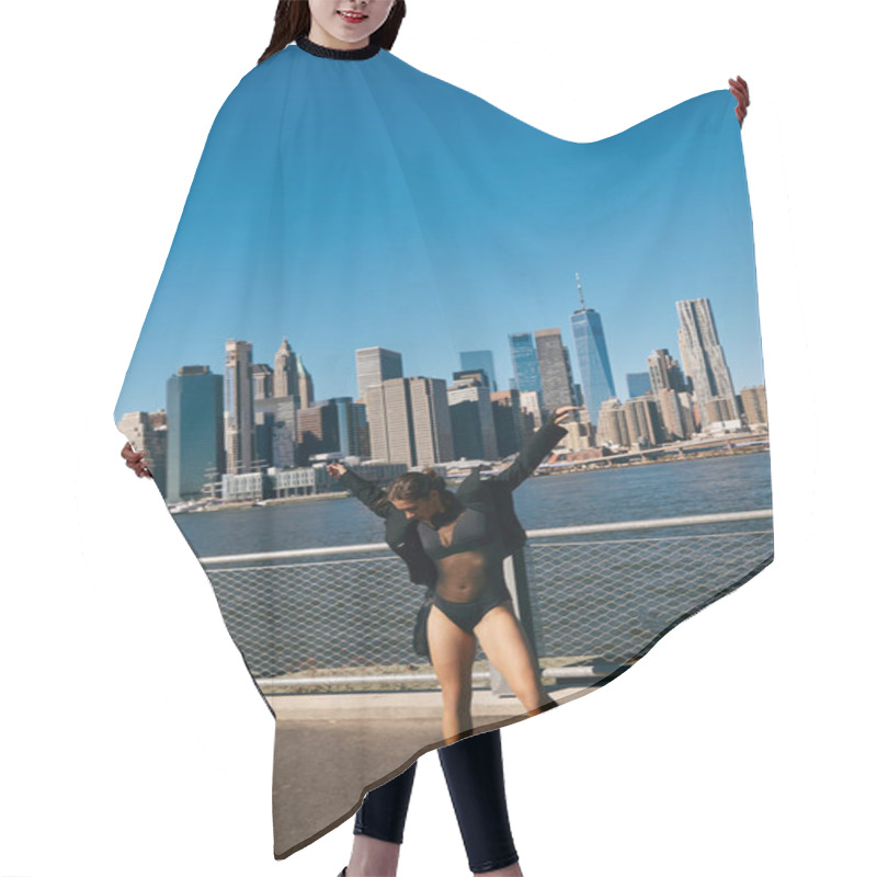 Personality  A Young Woman Dances On A New York City Pier With The City Skyline In The Background. Hair Cutting Cape