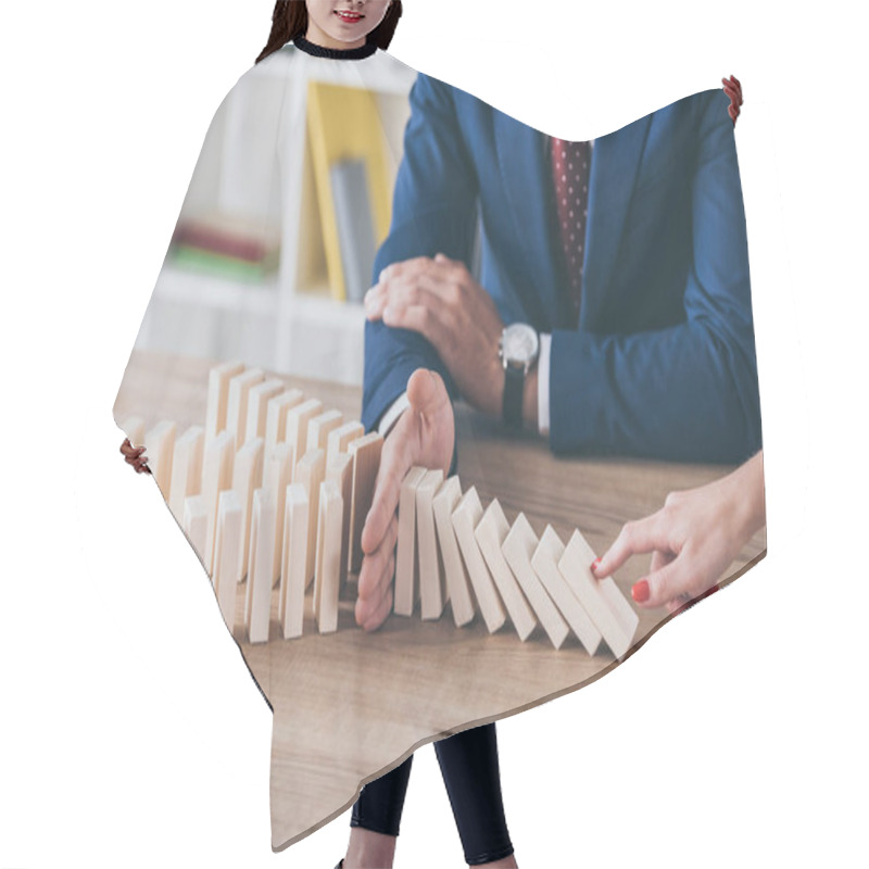 Personality  Cropped View Of Woman Pushing Wooden Block And Risk Manager Stopping Domino Effect Hair Cutting Cape