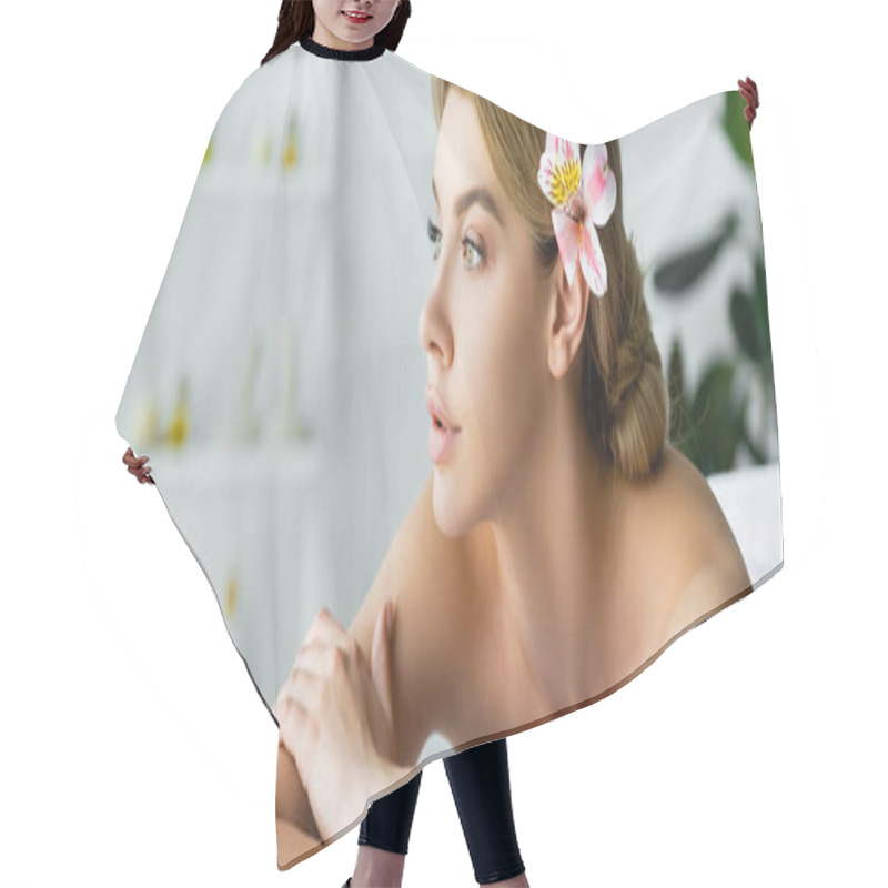 Personality  Panoramic Shot Of Attractive Woman With Flower Lying On Massage Mat In Spa  Hair Cutting Cape