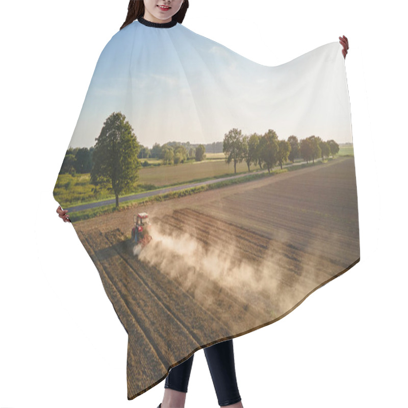 Personality  Red Tractor Working In Agricultural Field, Cultivating And Plowing Dry Soil, Aerial View. Agribusiness Concept. Small Farming Concept Hair Cutting Cape