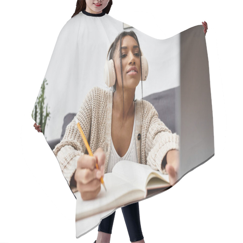 Personality  A Dedicated Young Woman Focuses On Her Studies At Home While Using A Laptop And Writing Notes. Hair Cutting Cape