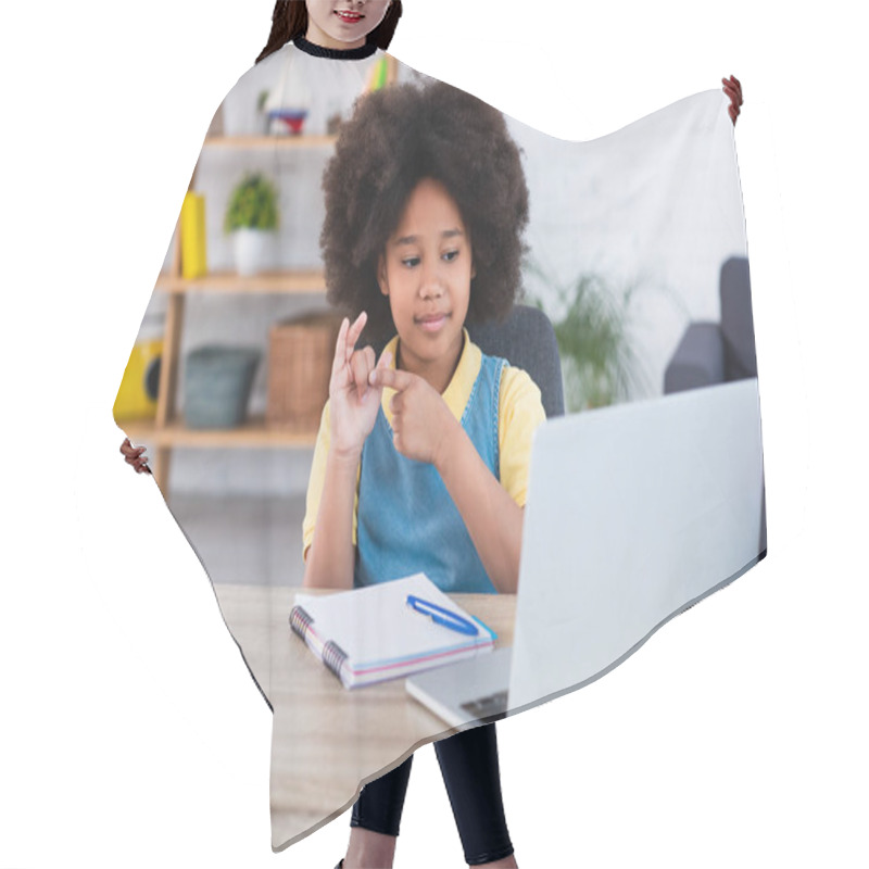 Personality  African American Girl Counting On Fingers Near Laptop And Stationery On Table  Hair Cutting Cape