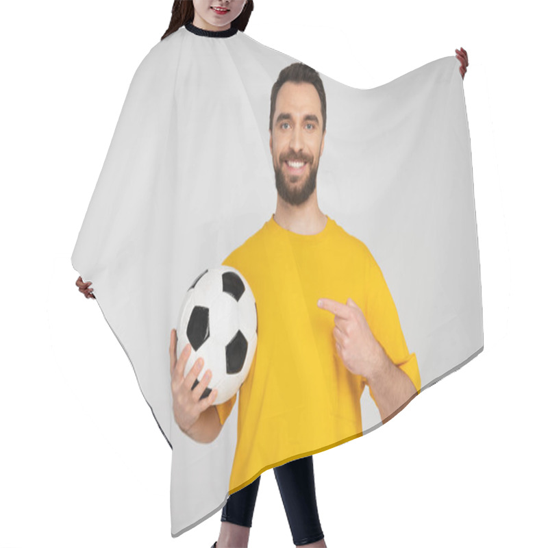 Personality  Joyful Football Fan In Yellow T-shirt Pointing At Soccer Ball Isolated On Grey Hair Cutting Cape