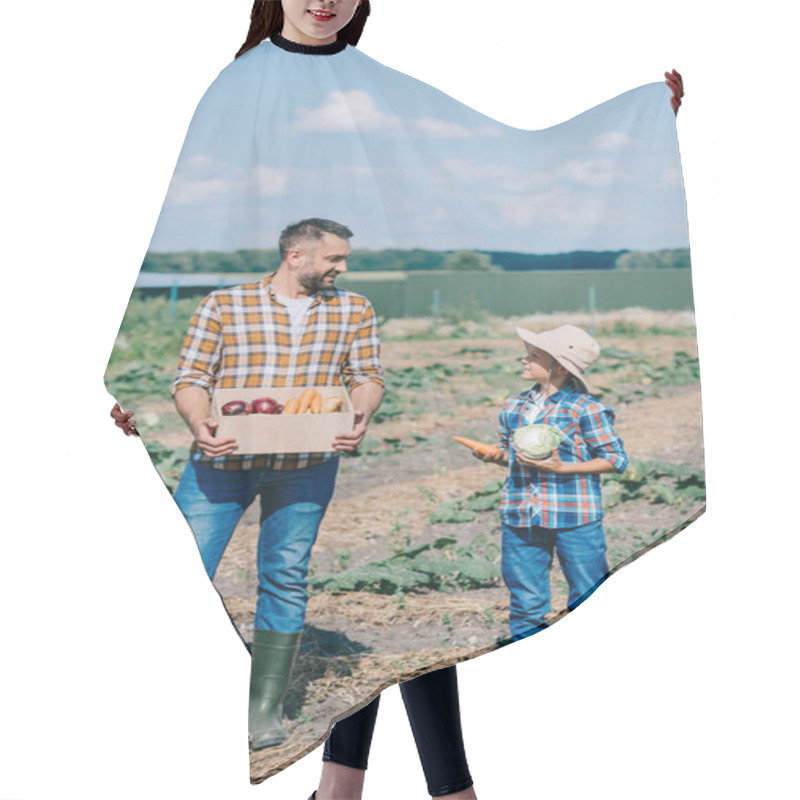 Personality  Happy Father And Son Holding Ripe Vegetables And Smiling Each Other In Field  Hair Cutting Cape