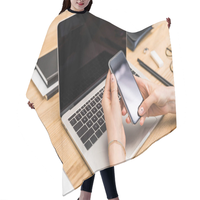 Personality  Cropped Shot Of Businesswoman Using Smartphone At Workplace With Laptop Hair Cutting Cape