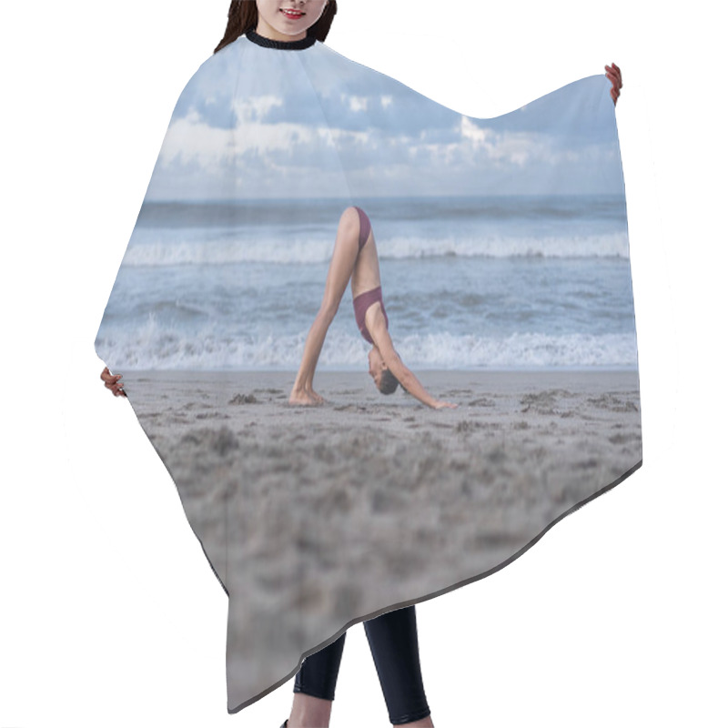 Personality  Side View Of Attractive Young Woman Practicing Yoga In Downward-Facing Dog Pose (Adho Mukha Svanasana) On Seashore Hair Cutting Cape