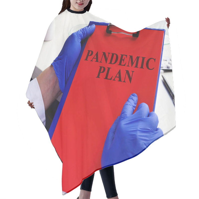 Personality  Doctor Is Reading Pandemic Plan For Preparedness. Hair Cutting Cape