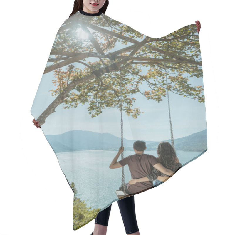 Personality  Couple Enjoying Nature From A Hill Top Sitting On A Swing Hair Cutting Cape