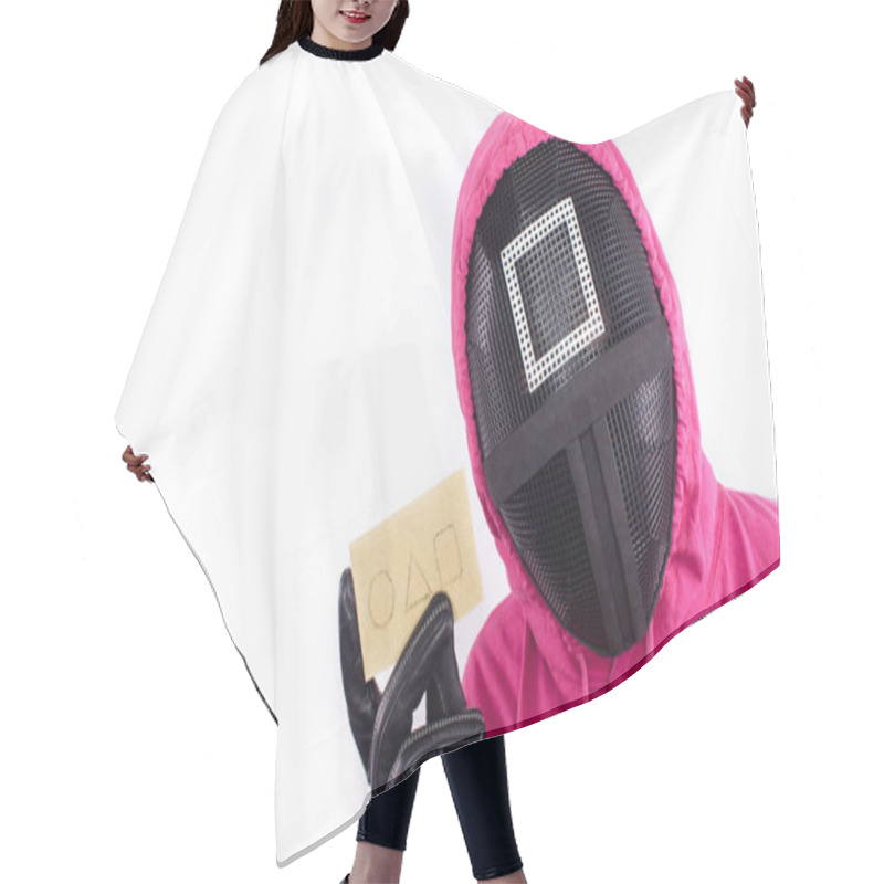 Personality  Pink Guard From Squid Game Of New Netflix Show. Squid Game Red Guard Holds Invitation Card On White Background. Space For Text. South Korean Tv Series.  Hair Cutting Cape