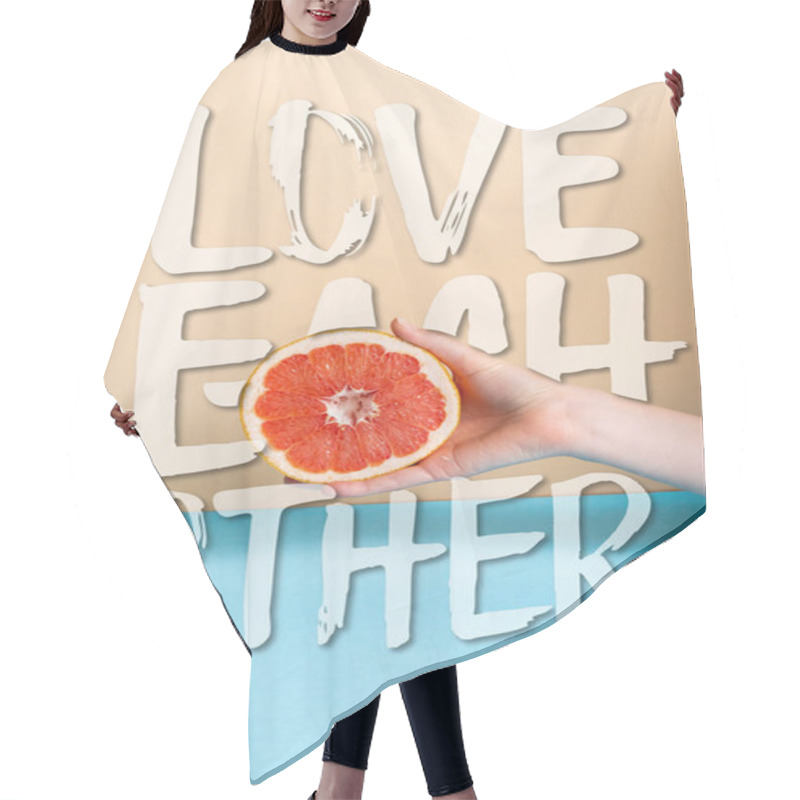 Personality  Cropped View Of Female Hand With Juicy Grapefruit Half Near Love Each Other Lettering On Beige And Blue  Hair Cutting Cape