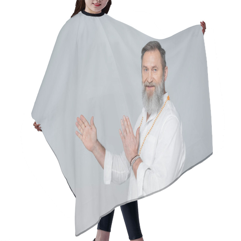 Personality  Spiritual Guru Looking At Camera And Pointing With Hands Isolated On Grey Hair Cutting Cape