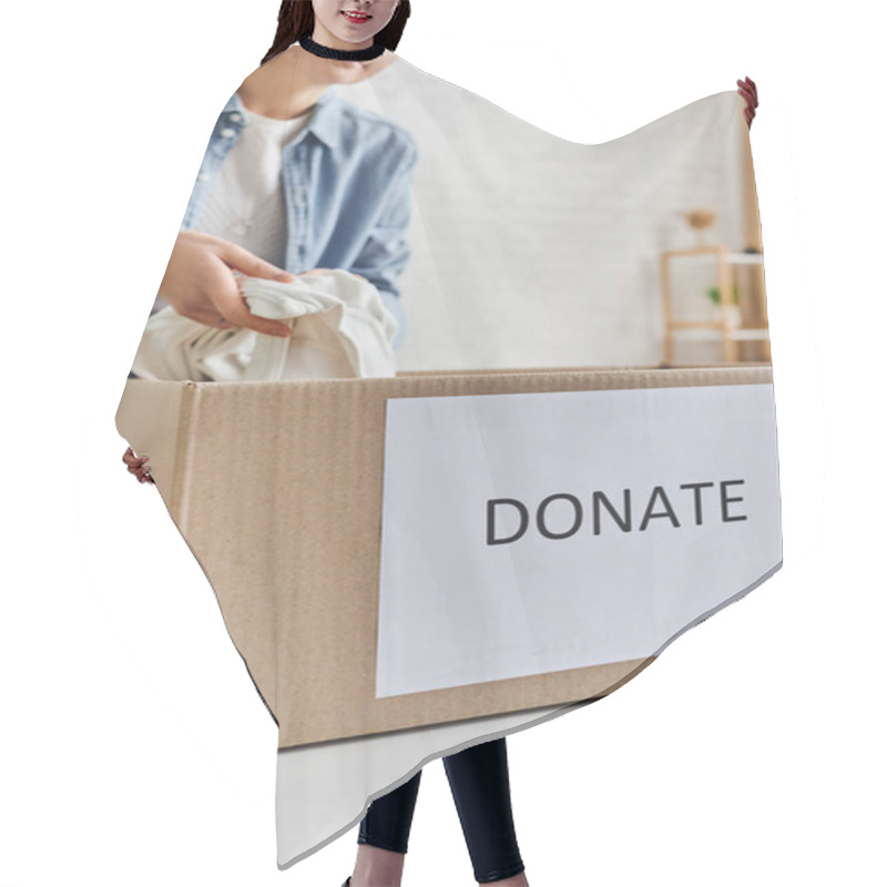 Personality  Partial View Of Young Woman In Casual Clothes Packing Garments In Carton Box With Donate Lettering, Promoting Social Good, Sustainable Living And Social Responsibility Concept, Blurred Background Hair Cutting Cape