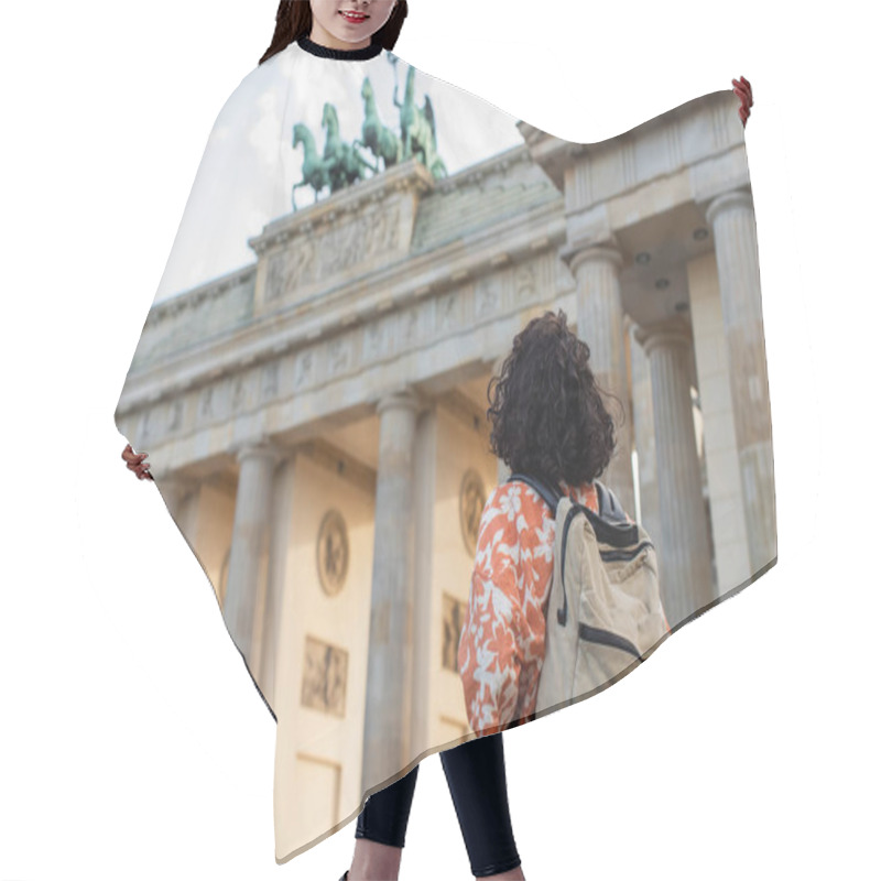 Personality  Back View Of Curly Tourist With Backpack Standing Near Brandenburg Gate In Berlin  Hair Cutting Cape