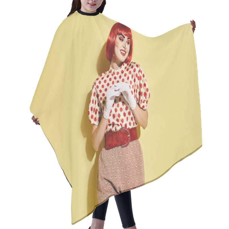 Personality  A Pretty Redhead Woman With Pop Art Makeup Wears A Polka Dot Shirt On A Vibrant Yellow Background. Hair Cutting Cape