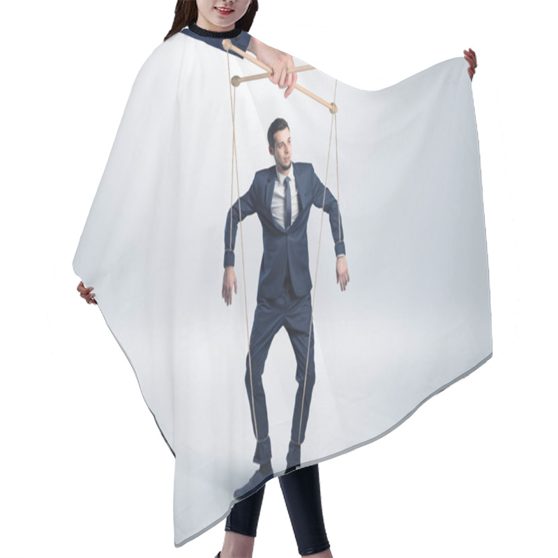 Personality  Puppet Businessman Leaded By A Huge Hand Hair Cutting Cape