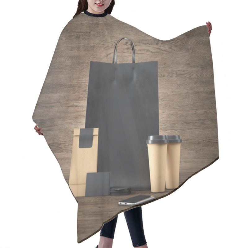 Personality  Set Of Black Shopping Bag, Two Brown Coffee Cups, Blank Business Cards And Generic Design Smartphone. Wood Background. 3d Render Hair Cutting Cape