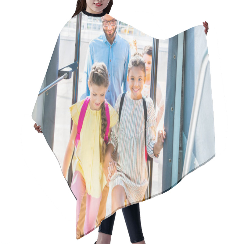 Personality  Group Of Schoolchildren Entering School Bus With Teacher Hair Cutting Cape