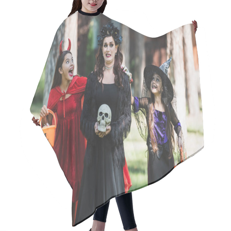 Personality  Girls In Devil And Witch Halloween Costumes Frightening Scared Mom In Forest Hair Cutting Cape