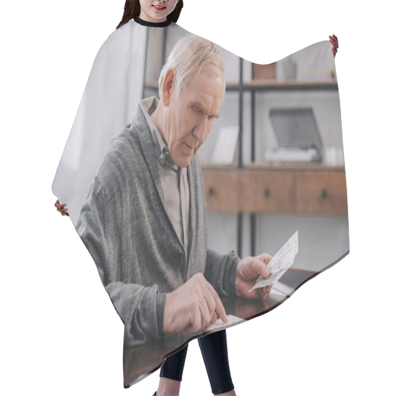 Personality  Senior Man Sitting At Table With Paperwork And Using Calculator While Counting Money  Hair Cutting Cape