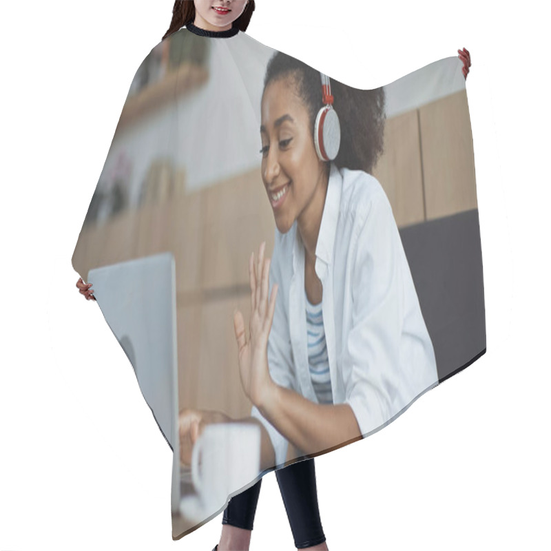 Personality  Happy African American Businesswoman In Wireless Headphones Having Video Call In Cafe Hair Cutting Cape