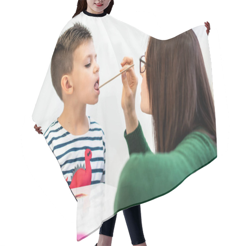 Personality  Children Speech Therapy Concept. Preschooler Practicing Correct Pronunciation With A Female Speech Therapist. Hair Cutting Cape