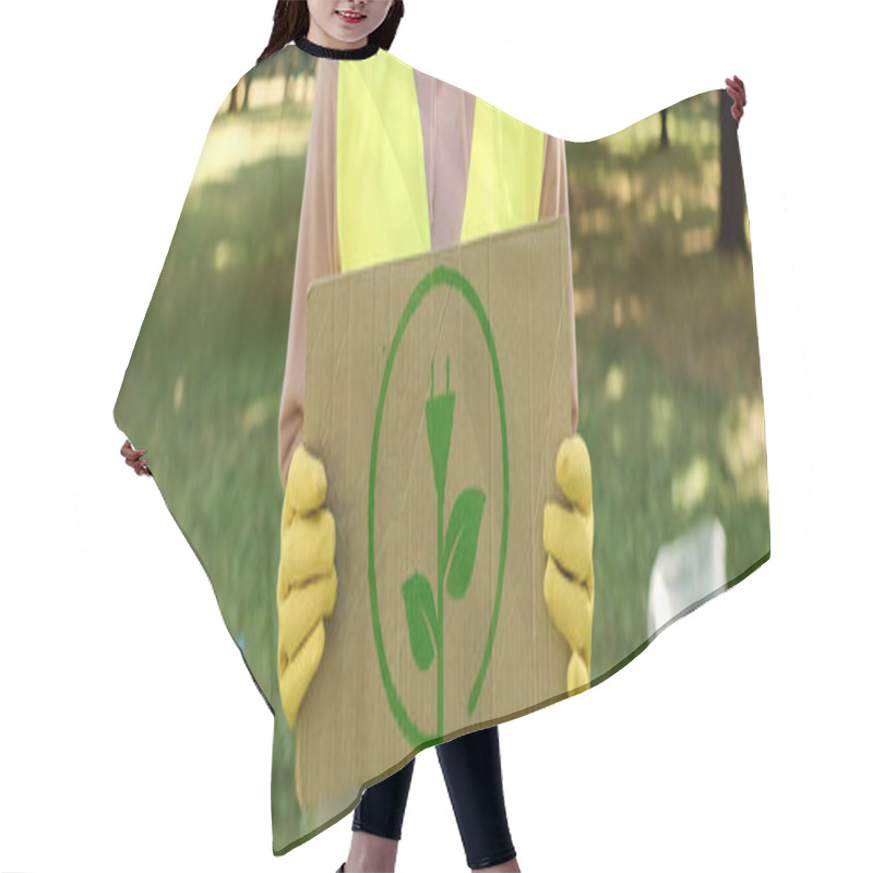 Personality  An Individual In A Vibrant Yellow Vest Holds A Cardboard Sign, Making A Statement With Determination. Hair Cutting Cape