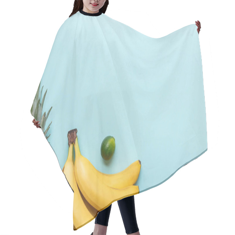 Personality  Top View Of Ripe Pineapple, Bananas And Lime On Blue Background With Copy Space Hair Cutting Cape