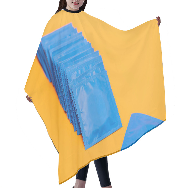 Personality  Blue Packs With Condoms Isolated On Orange  Hair Cutting Cape