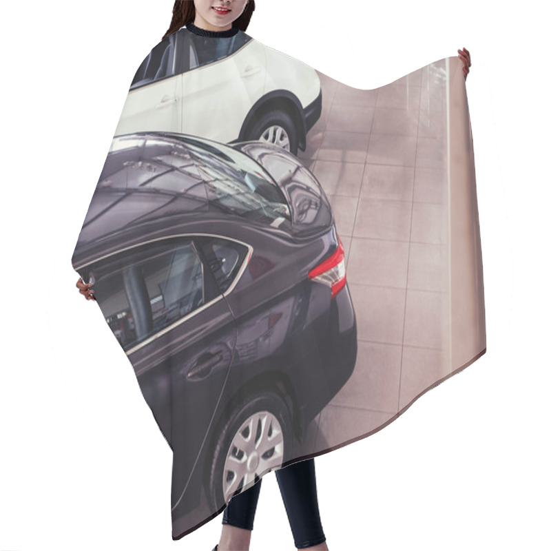 Personality  Of The Car In The Spacious Showroom With Large Windows. Hair Cutting Cape