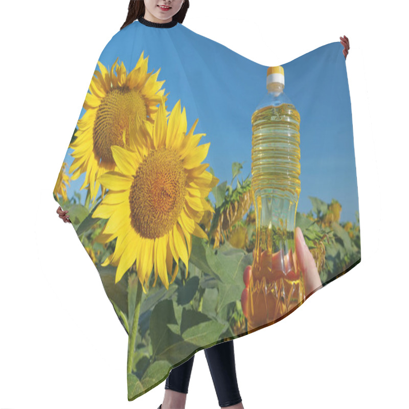 Personality  Agricultural Worker At The Field Of Sunflowers. Man Holds In Hand A Bottle Of Sunflower Oil Hair Cutting Cape