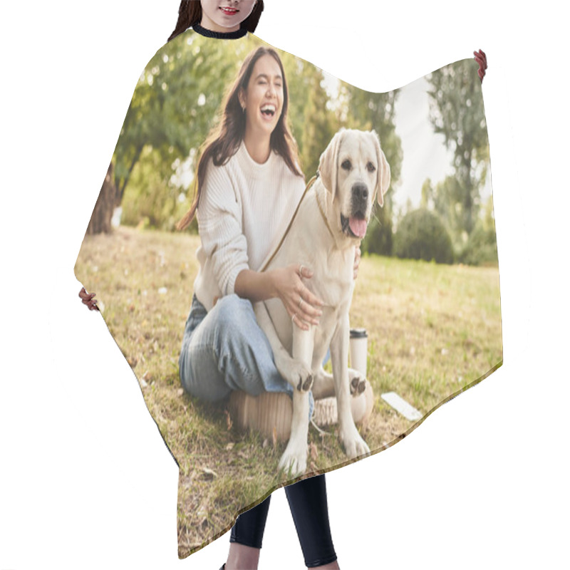 Personality  A Cheerful Woman In Cozy Autumn Attire Laughs While Playing With Her Dog In A Lovely Park. Hair Cutting Cape