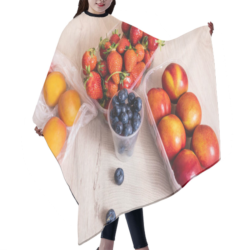 Personality  Fruit Composition With Blueberries, Strawberries, Nectarines And Peaches In Plastic Containers On Wooden Surface Hair Cutting Cape