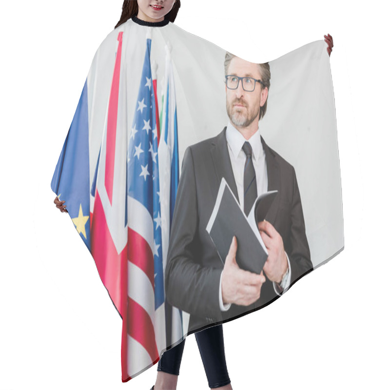 Personality  Bearded Diplomat Holding Folder Near Flags  Hair Cutting Cape