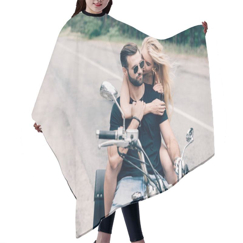 Personality  Young Tender Couple Of Bikers Hugging On Black Motorcycle On Road Near Green Forest Hair Cutting Cape