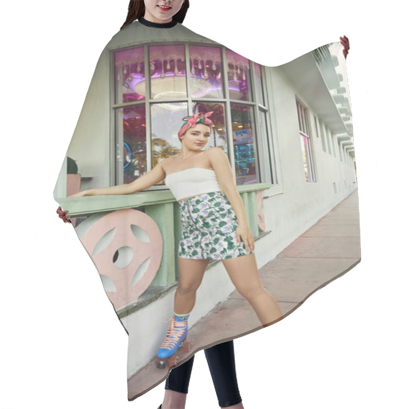 Personality  A Young Woman In Sunglasses And Stylish Attire Skates Past A Pink And Green Building In Miami. Hair Cutting Cape