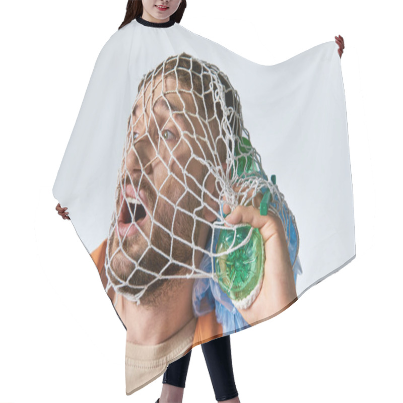 Personality  A Man Struggles With Plastic Waste, His Face Covered In A Net. Hair Cutting Cape