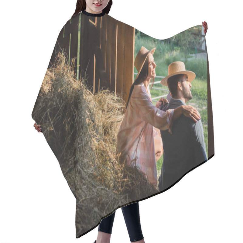 Personality  Happy Woman In Straw Hat Hugging Shoulders Of Husband While Sitting On Haystack In Barn Hair Cutting Cape