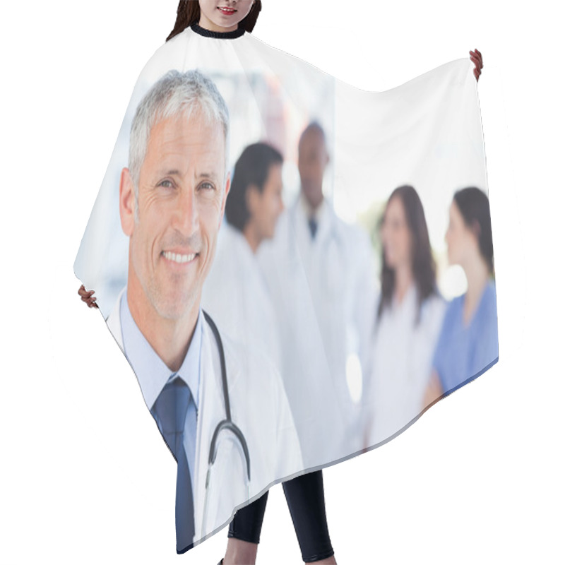 Personality  Mature Doctor Standing Upright While Waiting For His Team Hair Cutting Cape